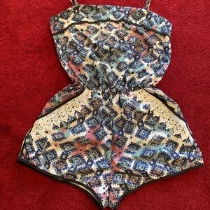 Spaghetti strap romper with lace pockets